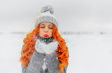 Fototapeta na wymiar Red-haired woman in wintertime