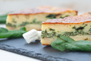 Delicious golden crust spinach feta cheese pie. Slices of spanakopita.