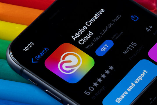 Mobile Adobe creative cloud app on appStore with a colorful plasticine background. Installing creative cloud on the iPhone. 