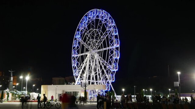 Ferris wheel in the night city. Seamless loop time lapse in high definition 4k Ultra HD 3840 x 2160, 30 FPS with copy space.