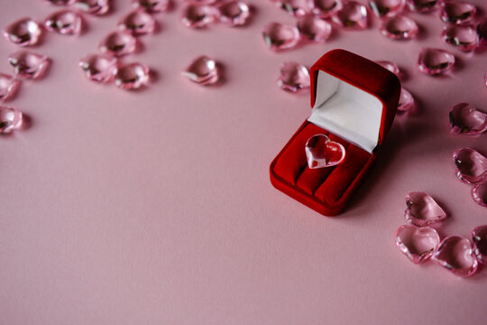 pink heart in a red box on a pink background among hearts.Valentine's Day

