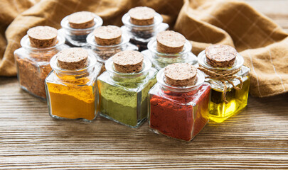 Jars with dried herbs, spices on the table
