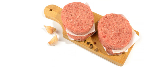 Raw beef patties for making a burger.Isolated on a white background.Selective Focus.