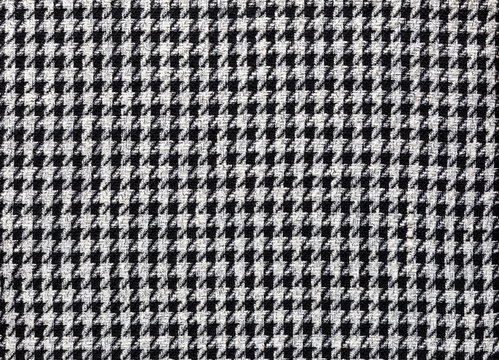 Fashionable fabric made of wool with pepita pattern in black and off-white, textile background image
