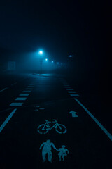 Fototapeta na wymiar scary road on misty night 