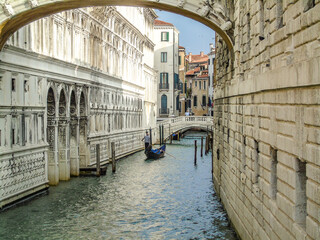 Empty Venice canal becouse of covid-19 and traditional colorful Venetian houses view. Classical Venice skyline. 