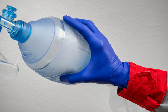 Paramedic using ambu bag.