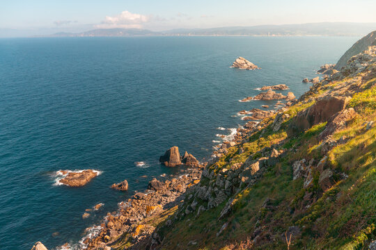 Beautiful landscape with cliff facing the sea and land in the background, in cabo ortegal, Galicia in the north of spain