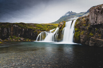 Fototapeta premium Kirkjufell foss. This is a photo taken from my home contry, Iceland. A beautiful contry yet a bit isolated. Kirkjufell is a must see place when you travel to Iceland. 