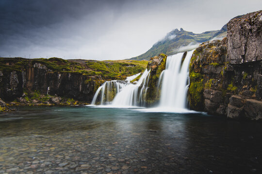 Kirkjufell foss. This is a photo taken from my home contry, Iceland. A beautiful contry yet a bit isolated. Kirkjufell is a must see place when you travel to Iceland. © Bjarni