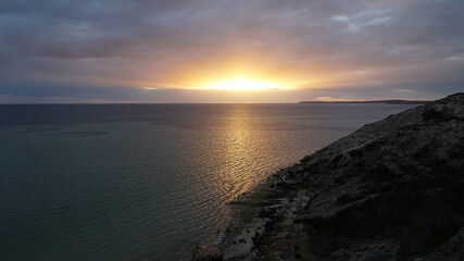 Sunset over the ocean at Shark Bay between Exmouth and Perth in Western Australia.