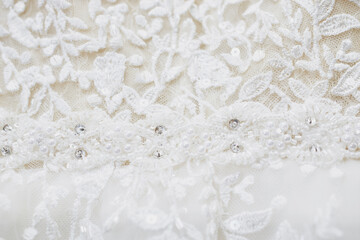 the texture of a wedding dress, embroidered with beads, rhinestones and sequins.