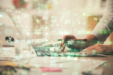 Double exposure of woman hands working on computer and data theme hologram drawing. Tech concept.