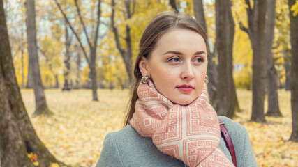 Beautiful girl walking in autumn Park, portrait, closeup, 16:9