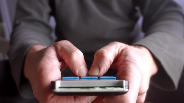 A man using Bank card reader chip reader authentication device to gain access to online banking accounts.