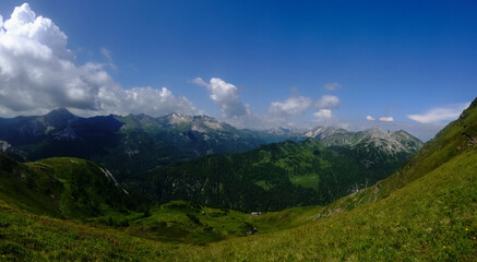 Fototapeta na wymiar mountain valley with green hills and beautiful sky panorama