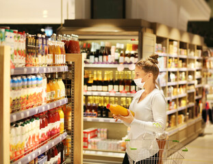 supermarket shopping, face mask and gloves,Woman choosing a dairy products at supermarket