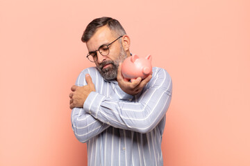 adult handsome man feeling in love, smiling, cuddling and hugging self, staying single, being...