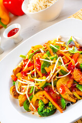 sweet and sour chicken with rice and vegetables