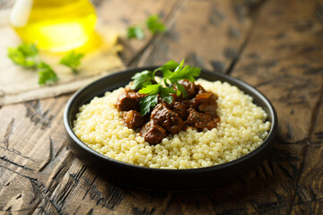 Ptitim with spicy beef ragout