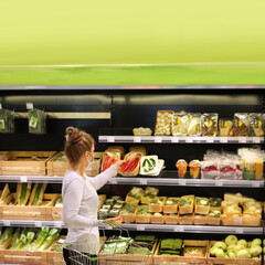 Woman buying fruits and vegetables at the market.