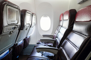 Empty cabin seats of an airplane.
