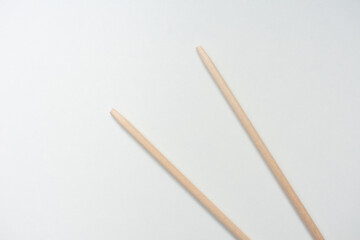 Fototapeta na wymiar Wooden chopsticks, white background, copy space