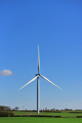 Large windmill against the blue sky.