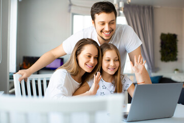 Happy family during an online video call.