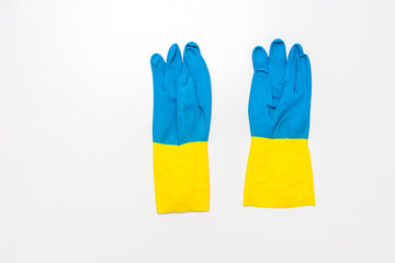 Blue rubber gloves in white background, copy space, top view