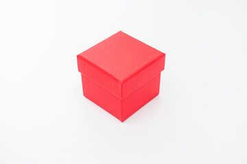 Red cardboard gift box, white background, copy space
