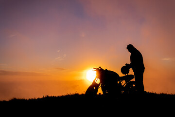 Motorbiker in the sunset, Azores, Sao Miguel island, silhouette.
