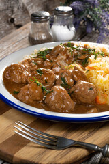 Minced meat balls in mushroom sauce.