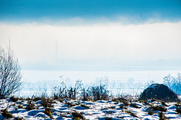landscape between fog and snow