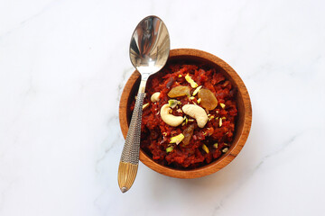 Gajar Halwa. Indian carrot pudding. It's a sweet dessert made from carrots, sugar, and cream. Garnished with cashew, almond, Raisin, and pistachio.