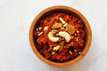 Gajar Halwa. Indian carrot pudding. It's a sweet dessert made from carrots, sugar, and cream. Garnished with cashew, almond, Raisin, and pistachio.