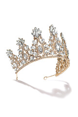 Subject shot of golden tiara adorned with a plenty of diamond-like gems and clear sparkling...