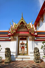Female Visitor Entering the Gorgeous Inner Entrance of Wat Pho Temple, Located in Rattanakosin Island of Bangkok, Thailand	