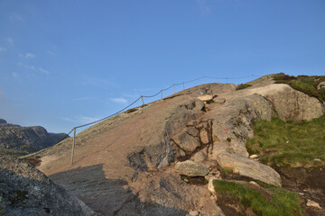 Fototapeta na wymiar Climbing rail to mountain summit