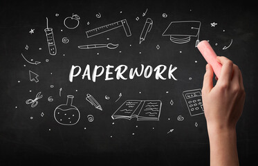 Hand drawing PAPERWORK inscription with white chalk on blackboard, education concept
