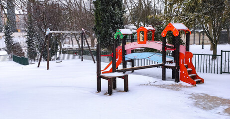 Snow-covered park and walks.
