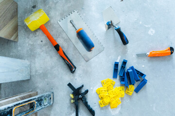 The tiling tools are on the floor. View from above.