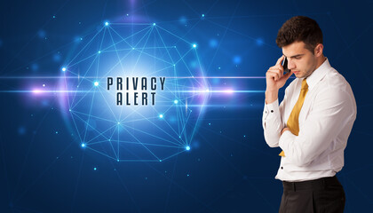 Businessman thinking about security solutions with PRIVACY ALERT inscription