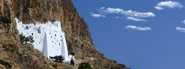 Ultra wide panoramic photo of famous Monastery of Hozoviotissa built in a steep rock in island of Amorgos, Cyclades, Greece