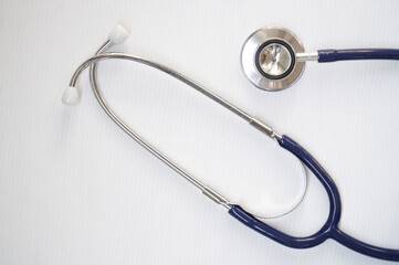 Listen to the doctor's heart. (Stethoscope or phonendoscope )