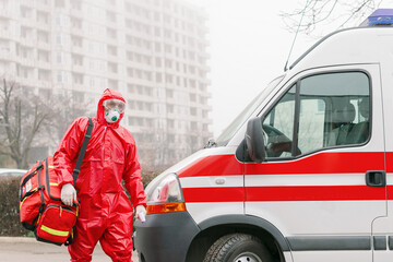 A doctor at an emergency ambulance service car goes to a patient with a suspected novel coronavirus...