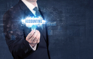 Businessman holding a light bulb with ACCOUNTING inscription, new business concept