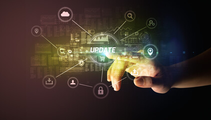 Hand touching UPDATE inscription, Cybersecurity concept
