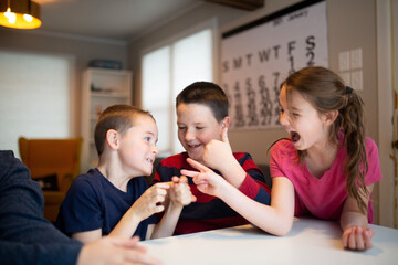 kids celebrating winning and losing a game together
