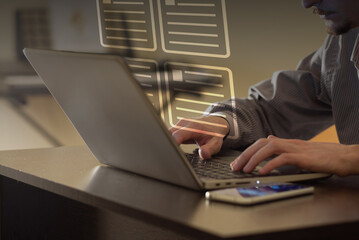 Person working on laptop in office. Layout and editing concept. Working with a text.